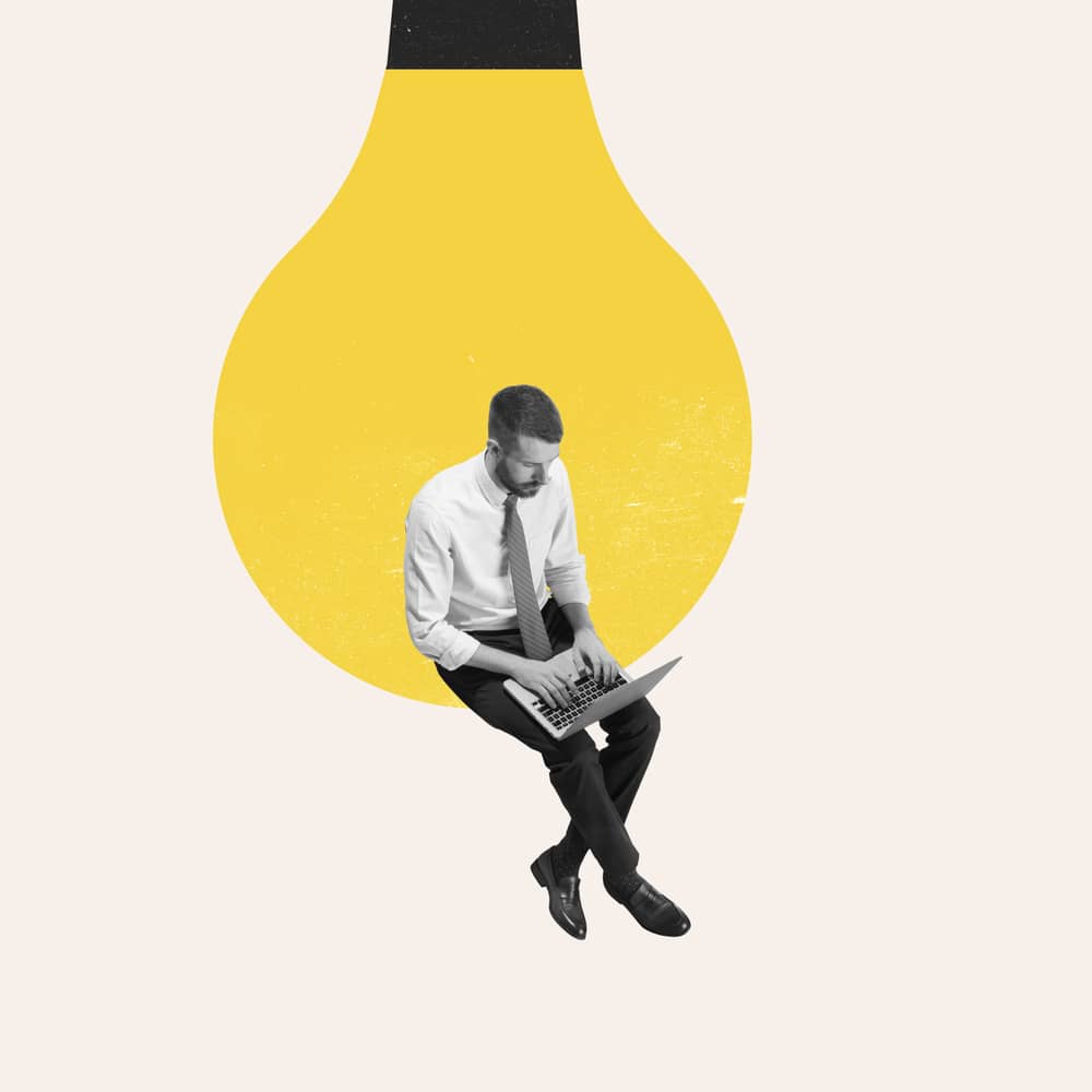 Podjetnik bere priročnik z navodili za vodenje podjetja